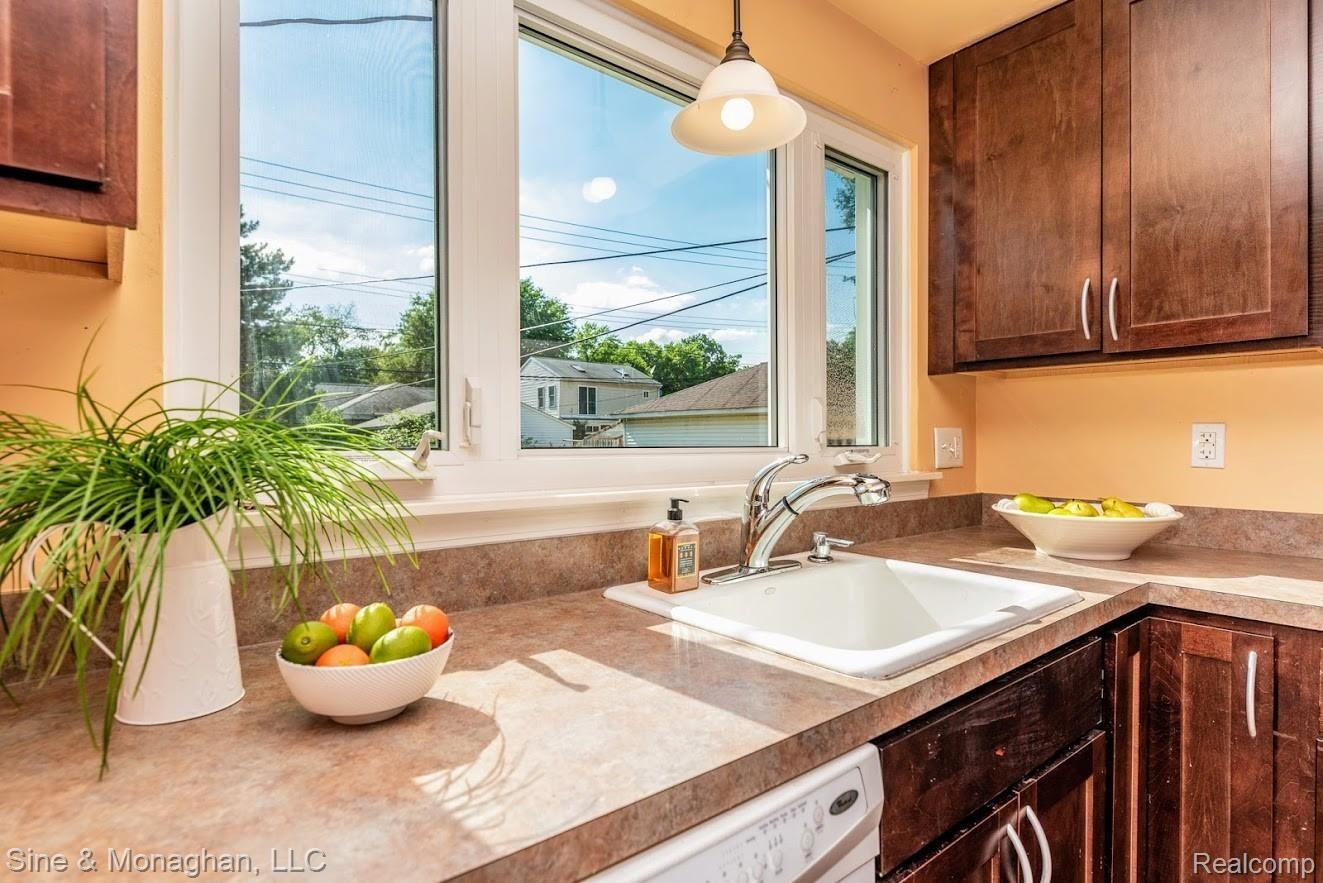 56 Maplefield Road Pleasant Ridge, MI 48069 - Photo 9 of 14 Kitchen sink/work area overlooks fenced backyard