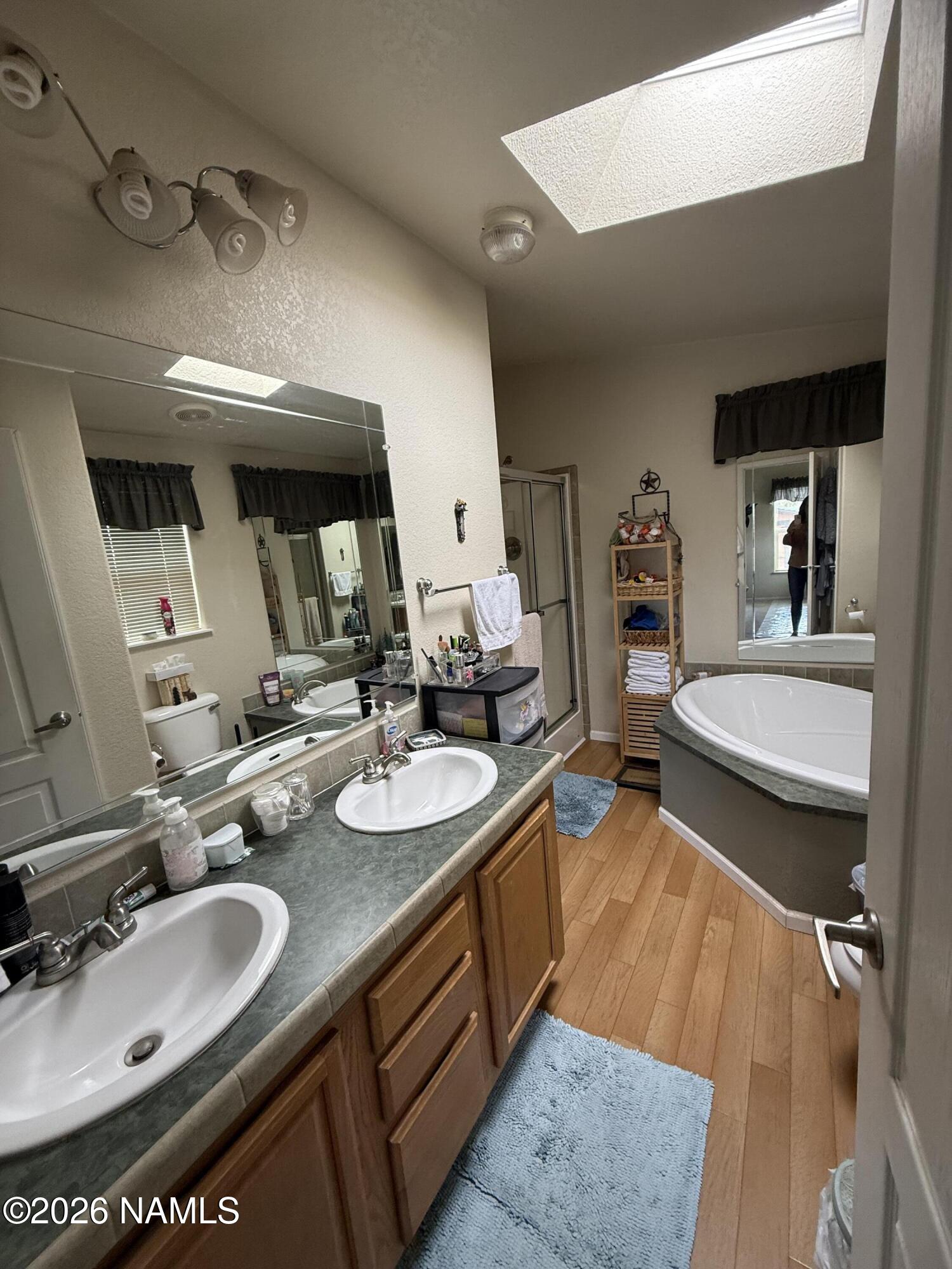 1431 East Cedar Road Williams, AZ 86046 - Photo 31 of 51 a bathroom with double vanity sink and a mirror
