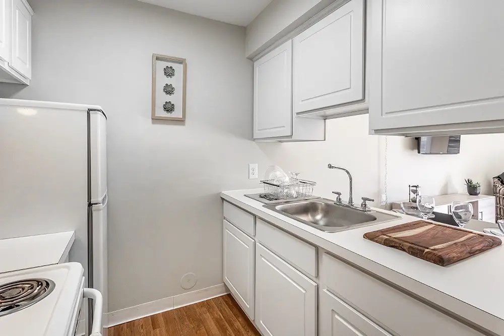 28301 Franklin Road Southfield, MI 48034 - Photo 3 of 7 a kitchen with a sink and a refrigerator