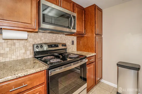 a kitchen with a sink and a refrigerator
