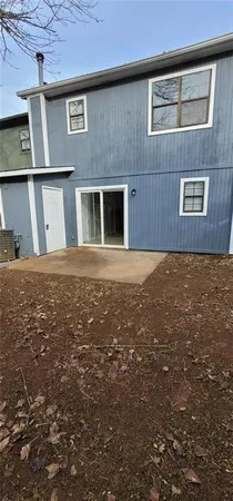 a view of a big yard with wooden fence