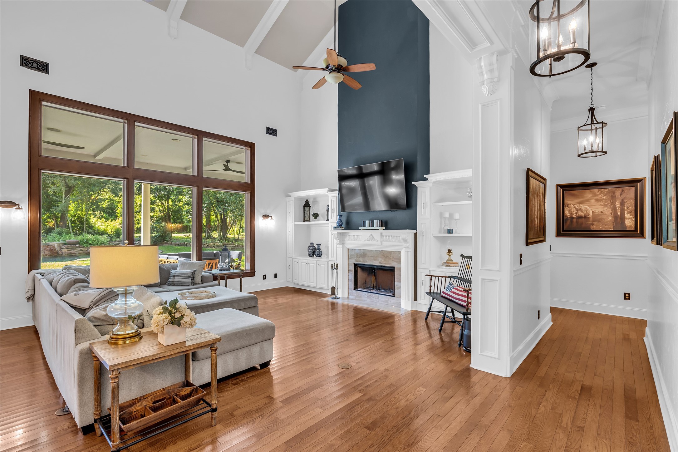 10478 River Ridge Lane Conroe, TX 77304 - Photo 11 of 50 Woodburning fireplace and beautiful hardwood floors