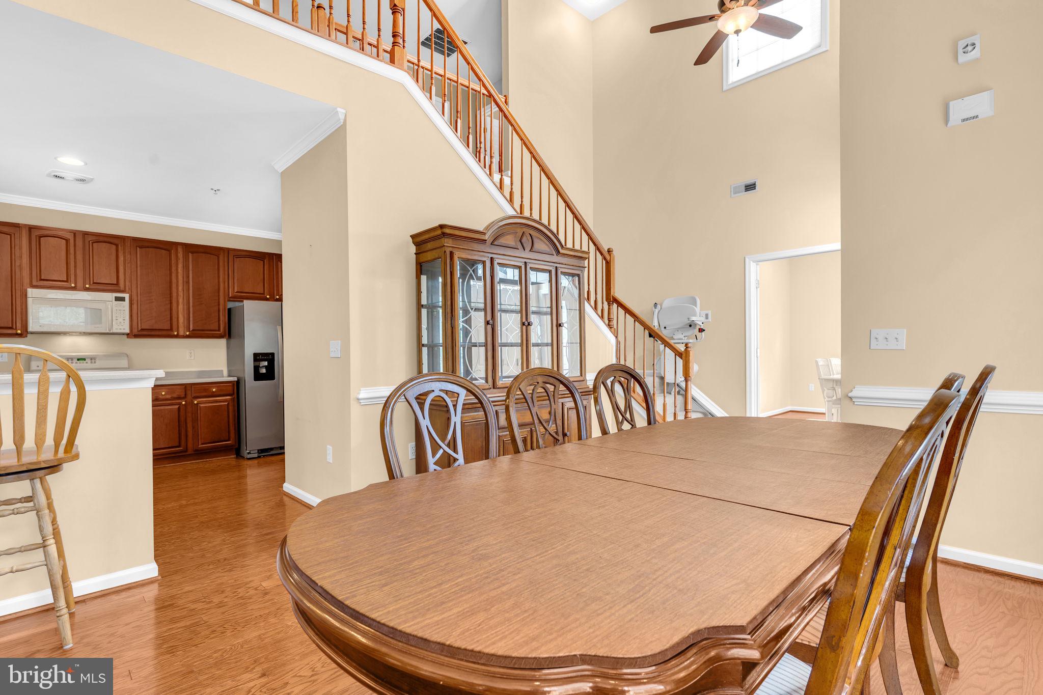 521 Marlboro Court, Unit 46 Solomons, MD 20629 - Photo 16 of 35 Dining area and soaring two story ceiling