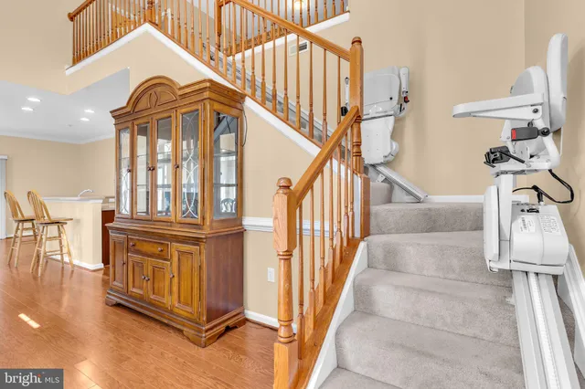 a view of staircase with white walls and a window