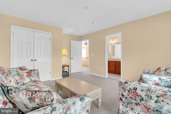 a bedroom with a bed and hallway