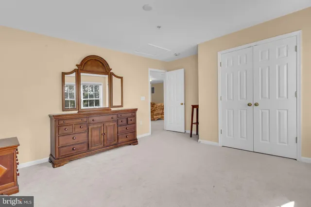 wooden floor with windows and a bathroom