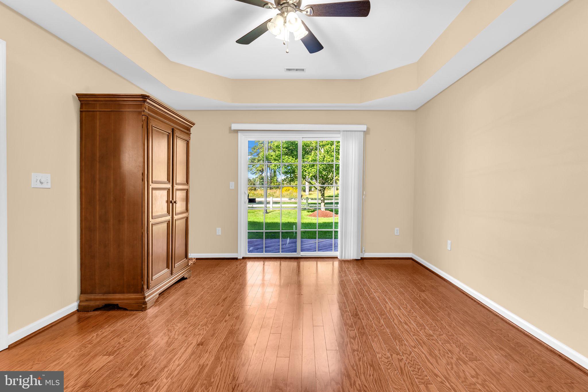 521 Marlboro Court, Unit 46 Solomons, MD 20629 - Photo 9 of 35 main level primary bedroom with slider to deck