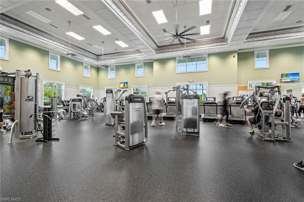 8795 Calypso Court Naples, FL 34113 - Photo 39 of 49 a view of a room with gym equipment