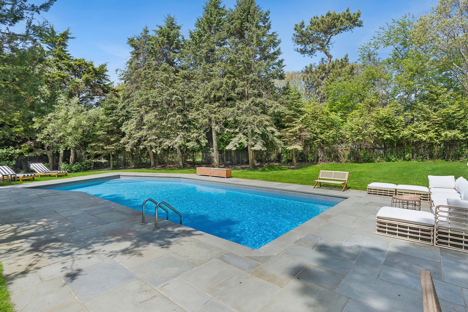 29 Petrel Road Southampton, NY 11968 - Photo 36 of 37 a view of a swimming pool with a yard