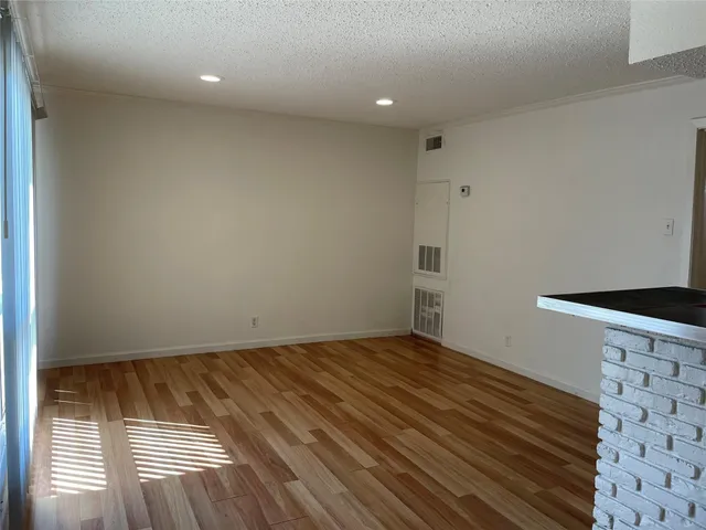 a view of wooden floor in an empty room