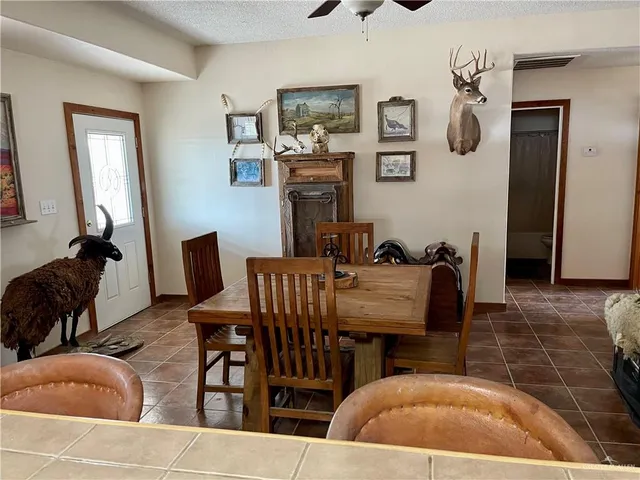 a kitchen with stainless steel appliances granite countertop a sink and a refrigerator
