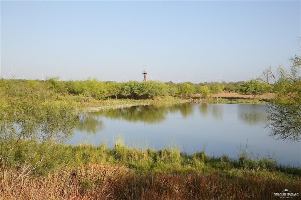 0 Loma Blanca Road Roma, TX 78584 - Photo 26 of 40 a view of a lake with houses in front of it