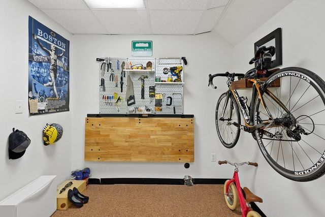 a view of house with backyard and outdoor seating