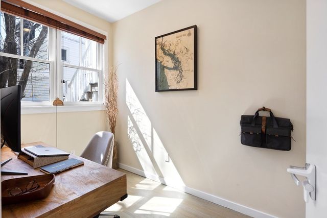 a view of a living room and dining room