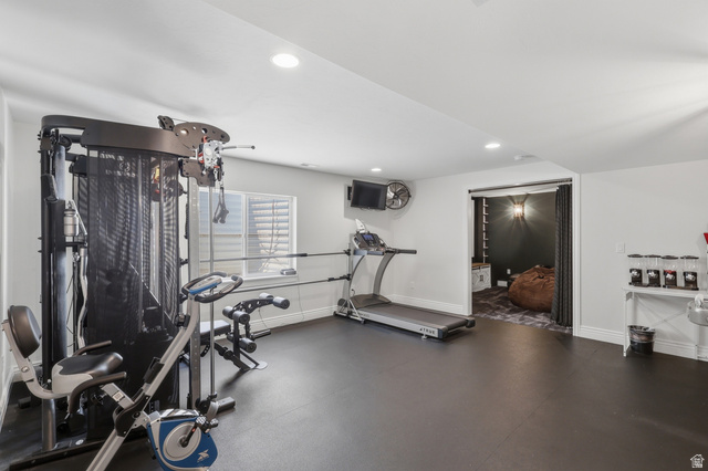 10676 Urban Rdg Cove South Jordan, UT 84095 - Photo 38 of 48 Dedicated recreation room featuring recessed lighting, a window with horizontal blinds, and dark rubber flooring