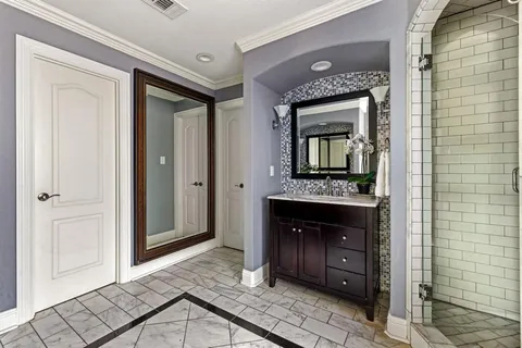 a living room with a fireplace and a wooden floor