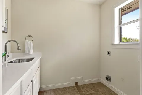 a bathroom with a sink and a window