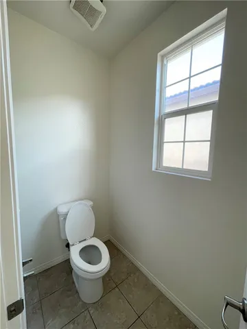 an empty room with a empty space and a window