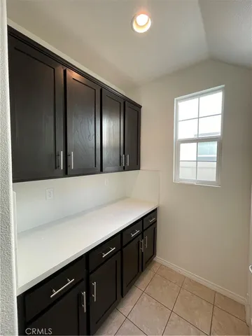 a bathroom with a sink and a large mirror
