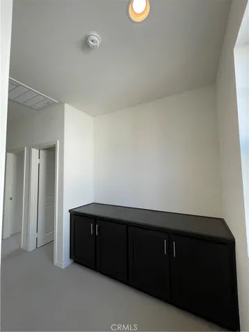 a bathroom with a granite countertop sink a mirror and a window
