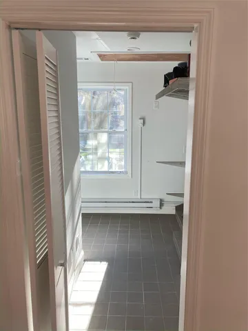 a view of an empty room with a window