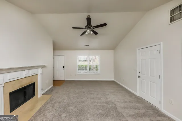 wooden floor in an empty room with a fireplace