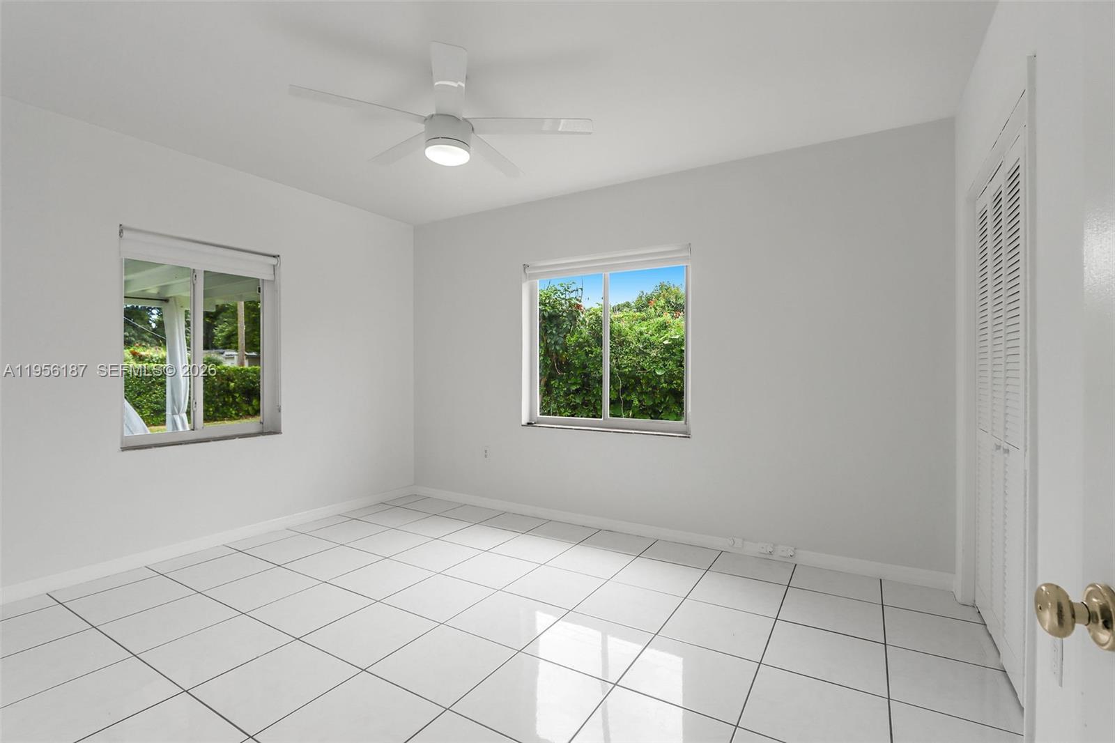 6050 Southwest 44th Terrace Miami, FL 33155 - Photo 14 of 18 an empty room with windows