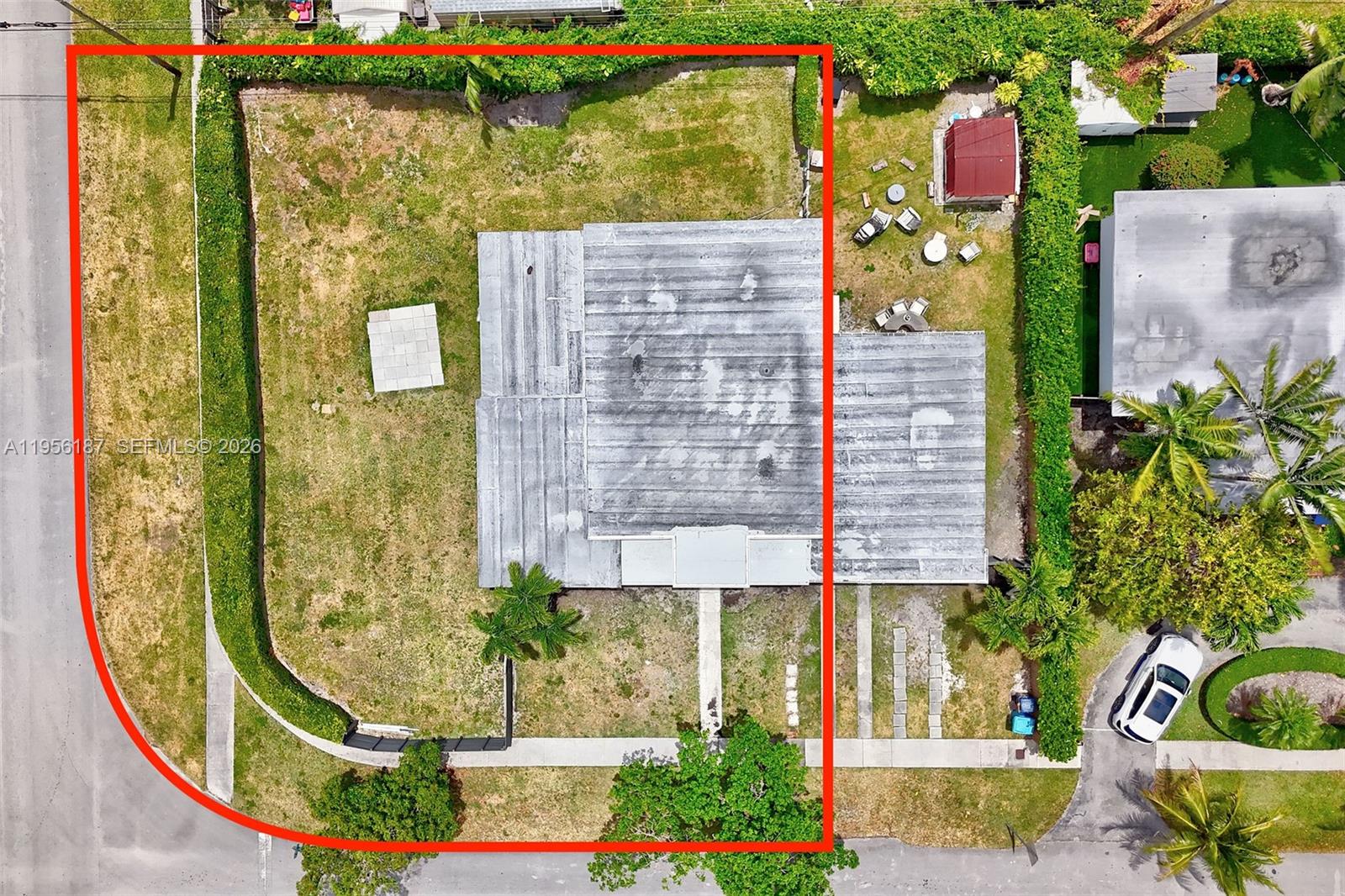 6050 Southwest 44th Terrace Miami, FL 33155 - Photo 4 of 18 view of a brick building with a yard