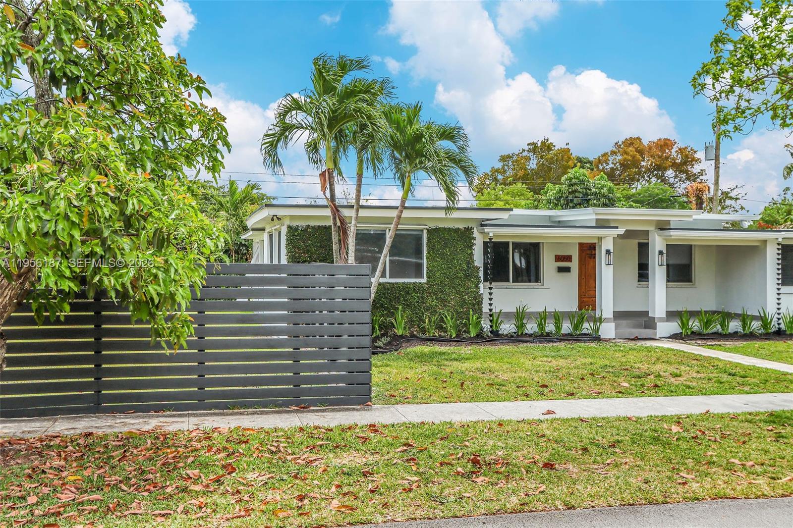 6050 Southwest 44th Terrace Miami, FL 33155 - Photo 5 of 18 a view of a house with a yard