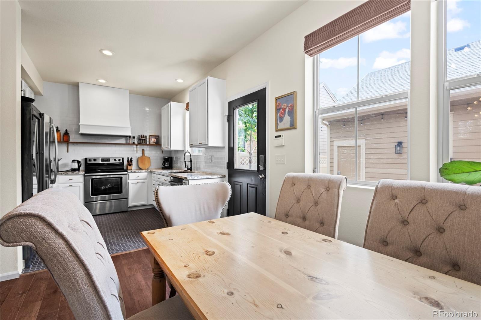 10281 Bellwether Lane Lone Tree, CO 80124 - Photo 11 of 47 a living room with furniture and a large window