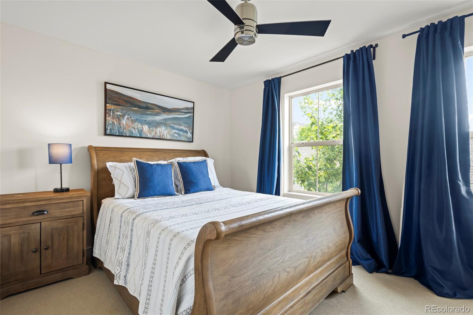 10281 Bellwether Lane Lone Tree, CO 80124 - Photo 14 of 47 a bedroom with a bed and a window