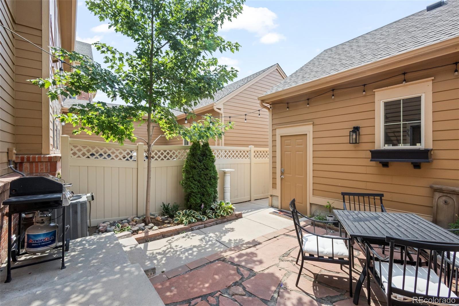 10281 Bellwether Lane Lone Tree, CO 80124 - Photo 34 of 47 a view of a house with backyard and sitting area
