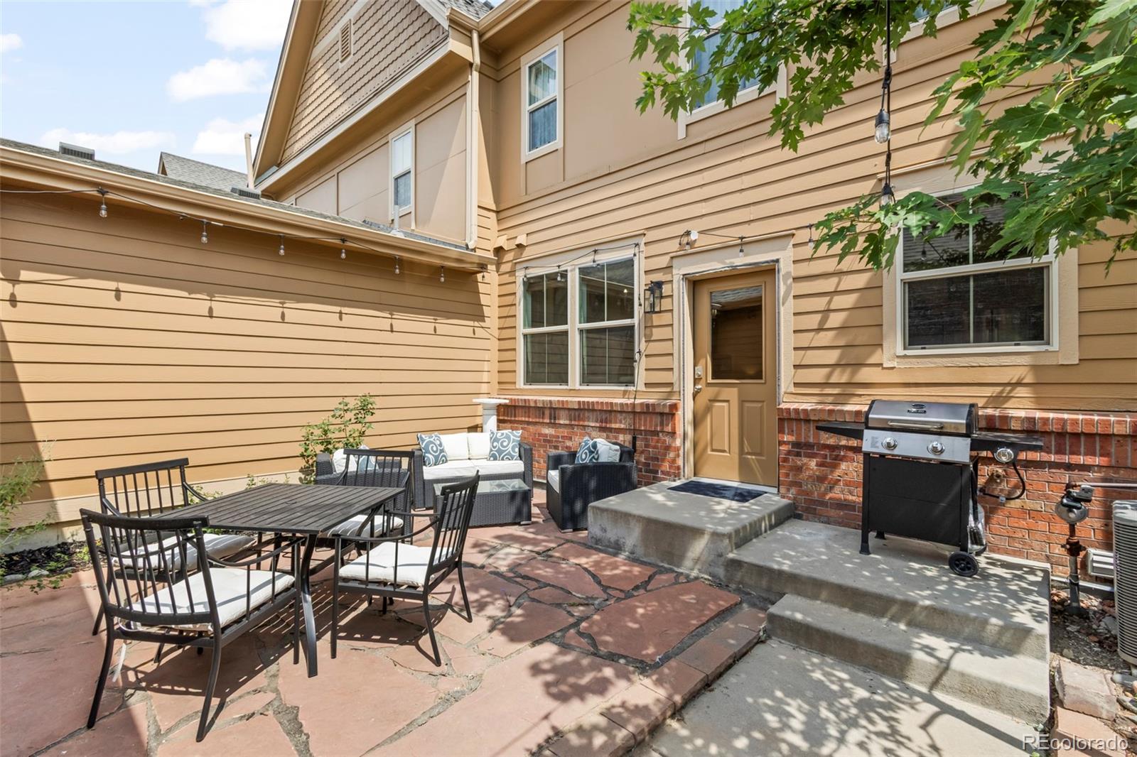 10281 Bellwether Lane Lone Tree, CO 80124 - Photo 35 of 47 a view of a dinning table and chairs in the patio
