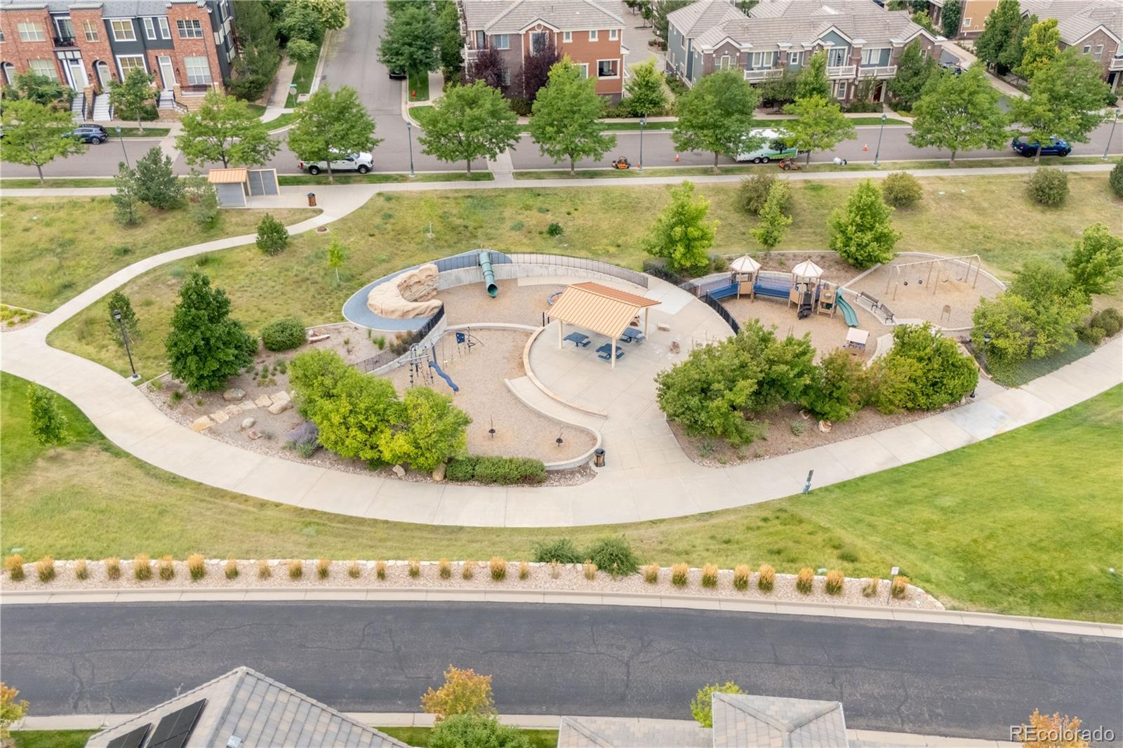 10281 Bellwether Lane Lone Tree, CO 80124 - Photo 42 of 47 an aerial view of a house with a yard and lake view