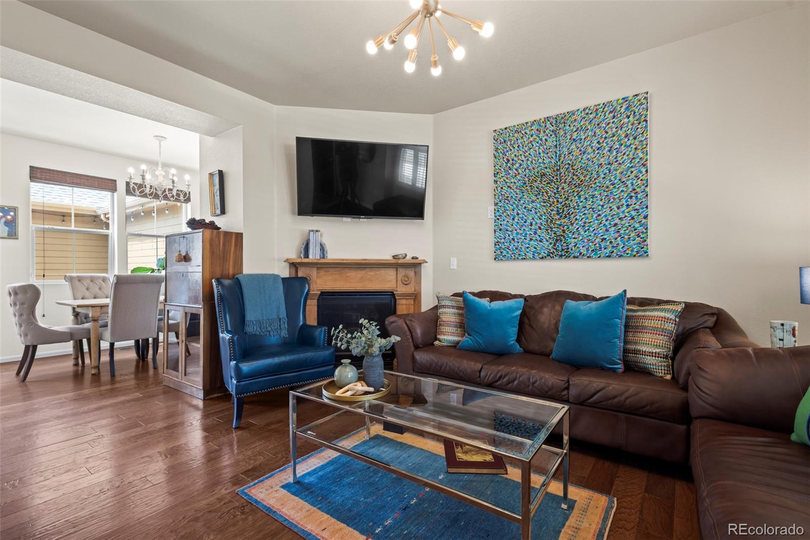 10281 Bellwether Lane Lone Tree, CO 80124 - Photo 5 of 47 a living room with furniture and a flat screen tv