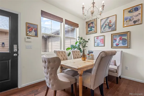 a view of a dining room with furniture window and wooden floor