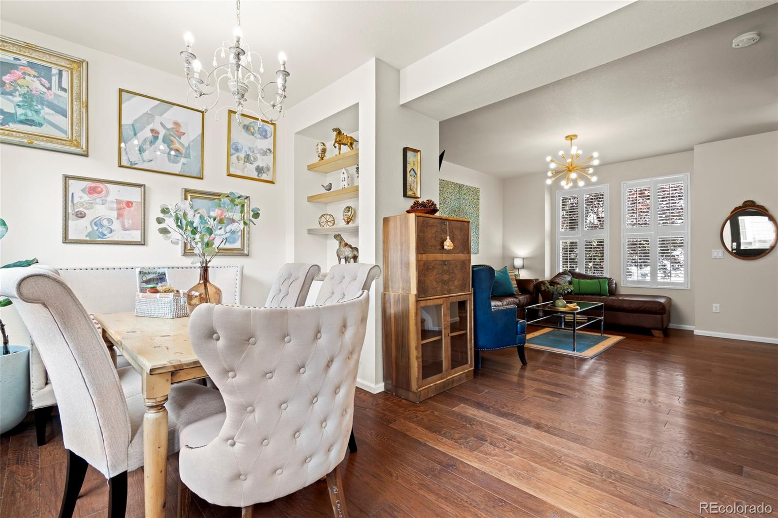 10281 Bellwether Lane Lone Tree, CO 80124 - Photo 10 of 47 a living room with furniture or couch and a chandelier