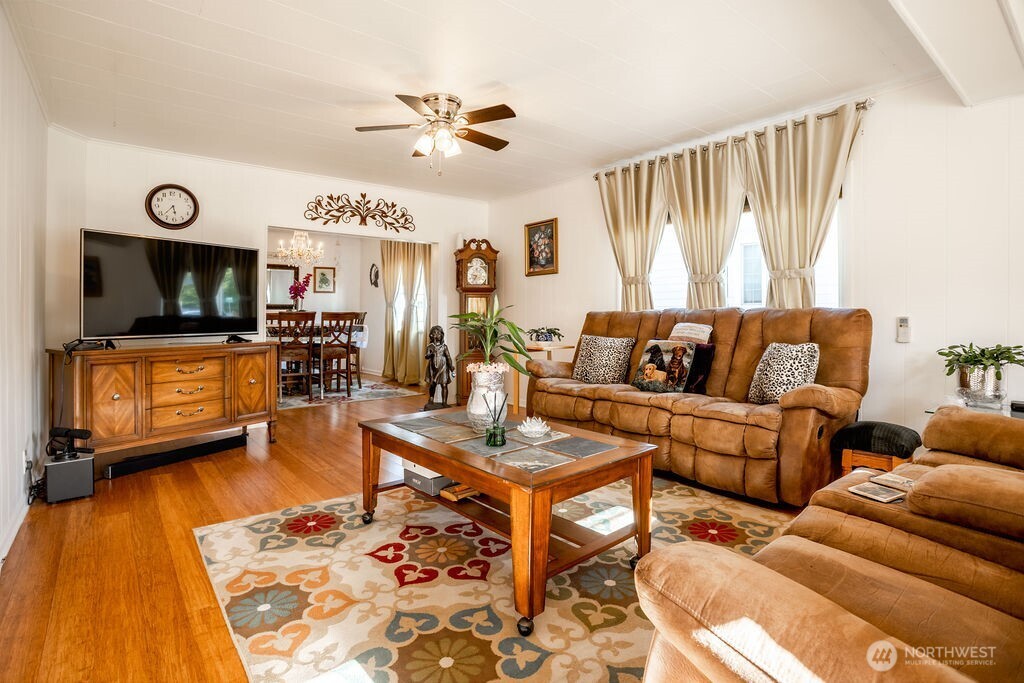404 Jackson Street Ryderwood, WA 98581 - Photo 11 of 27 a living room with furniture and a flat screen tv