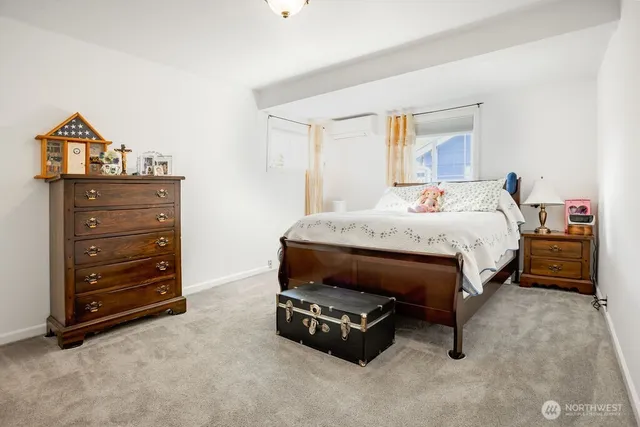 a bedroom with a bed and a dresser