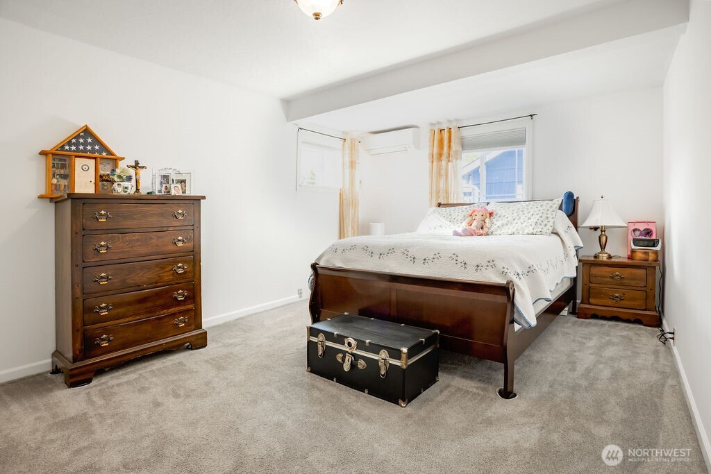 404 Jackson Street Ryderwood, WA 98581 - Photo 14 of 27 a bedroom with a bed and a dresser