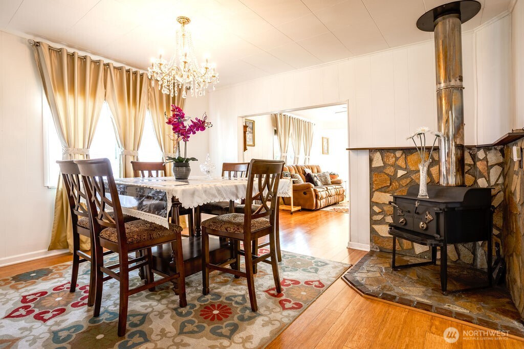 404 Jackson Street Ryderwood, WA 98581 - Photo 17 of 27 a view of a dining room with furniture window and wooden floor