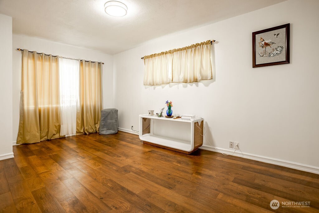 404 Jackson Street Ryderwood, WA 98581 - Photo 19 of 27 a view of a room with wooden floor and window