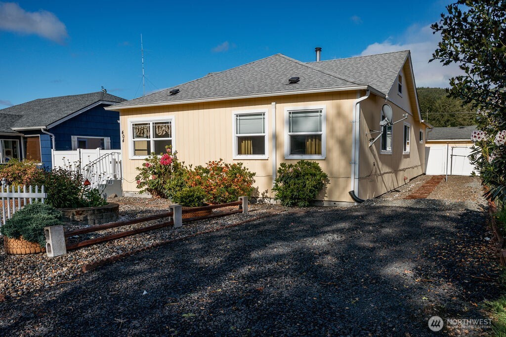 404 Jackson Street Ryderwood, WA 98581 - Photo 3 of 27 a front view of a house with a yard