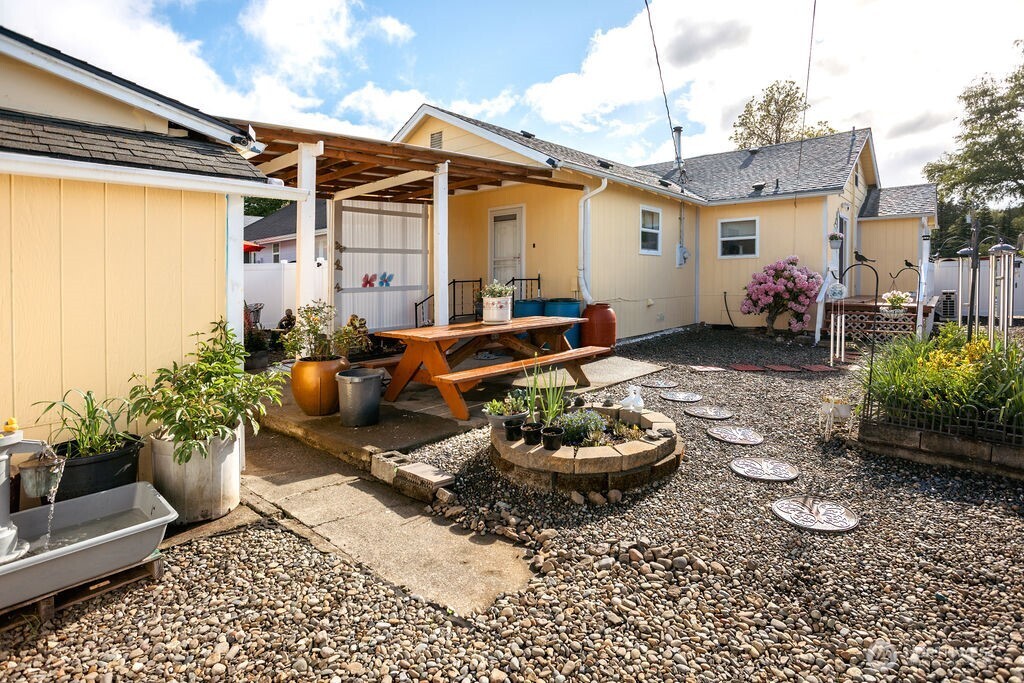 404 Jackson Street Ryderwood, WA 98581 - Photo 4 of 27 a view of a patio with couches and potted plants