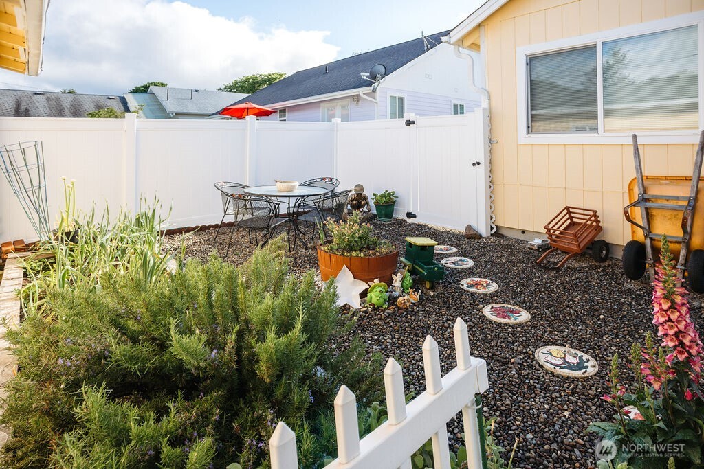 404 Jackson Street Ryderwood, WA 98581 - Photo 5 of 27 a backyard of a house with lots of green space and outdoor seating