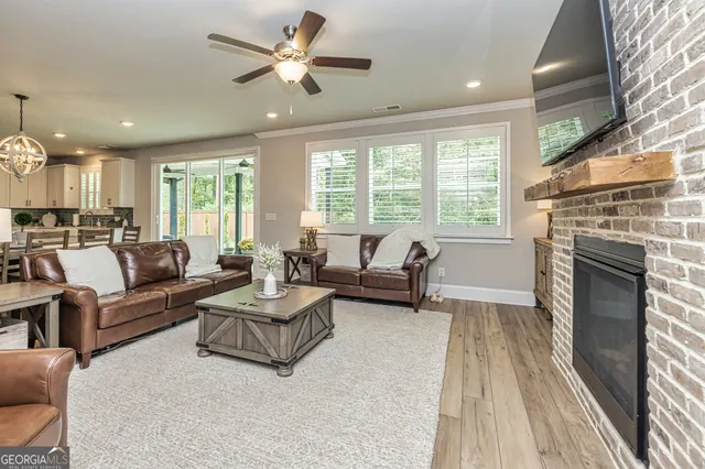 a view of a dining room with furniture wooden floor and chandelier