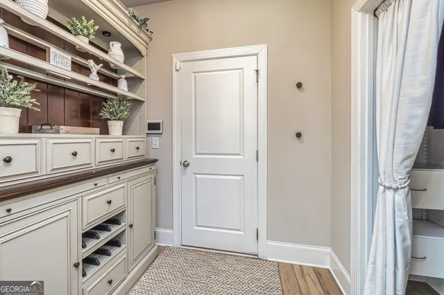 a bedroom with furniture and a window