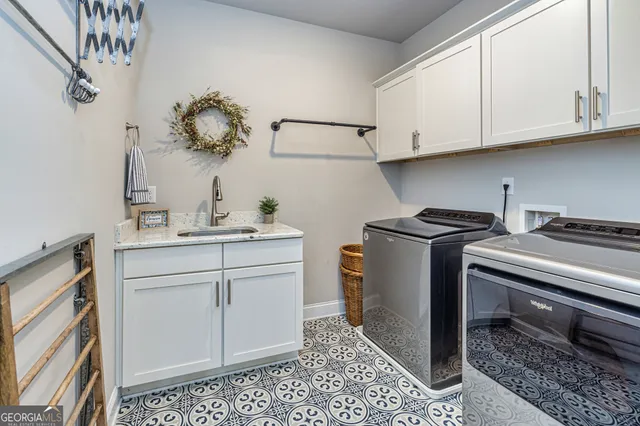 a spacious bedroom with a bed and a chandelier
