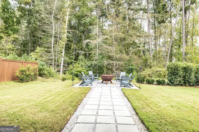 a view of a patio with a table and chairs