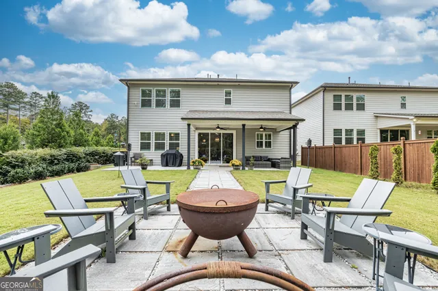 an aerial view of residential houses with outdoor space
